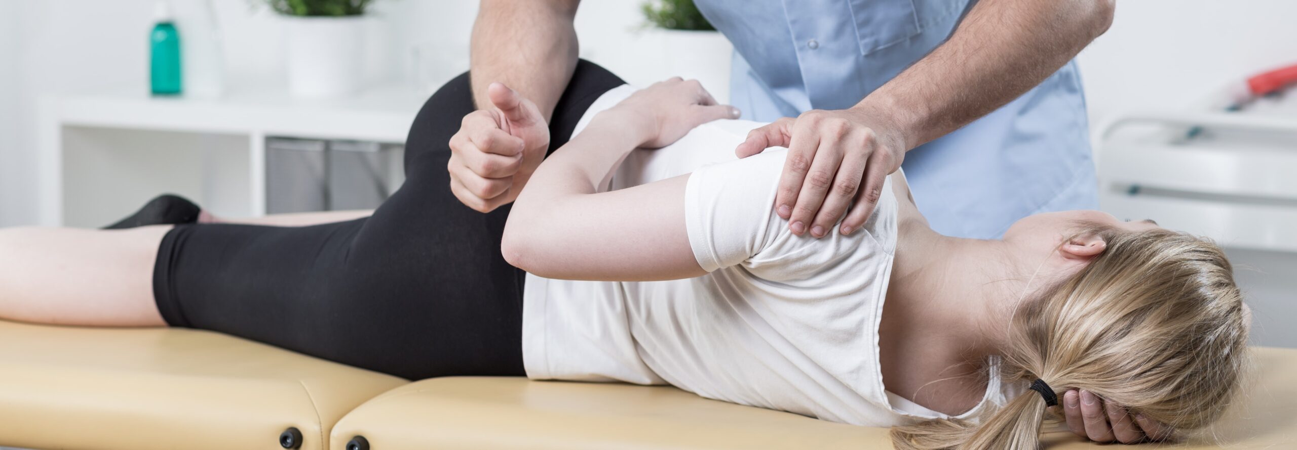 Chiropractor performing adjustment on patient.