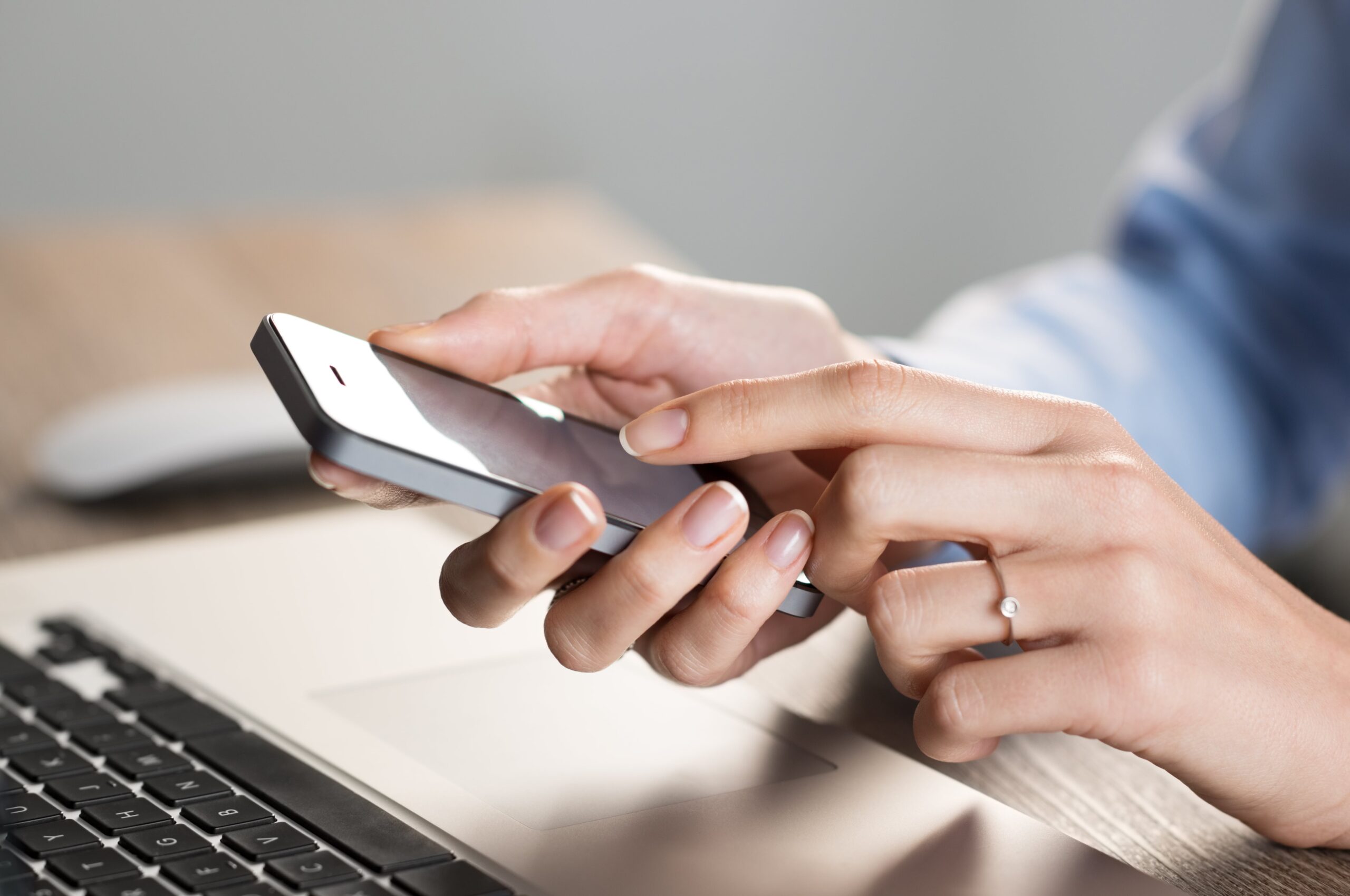 Closeup image of woman using phone.